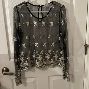 Woman’s sheer/mesh embroidered top